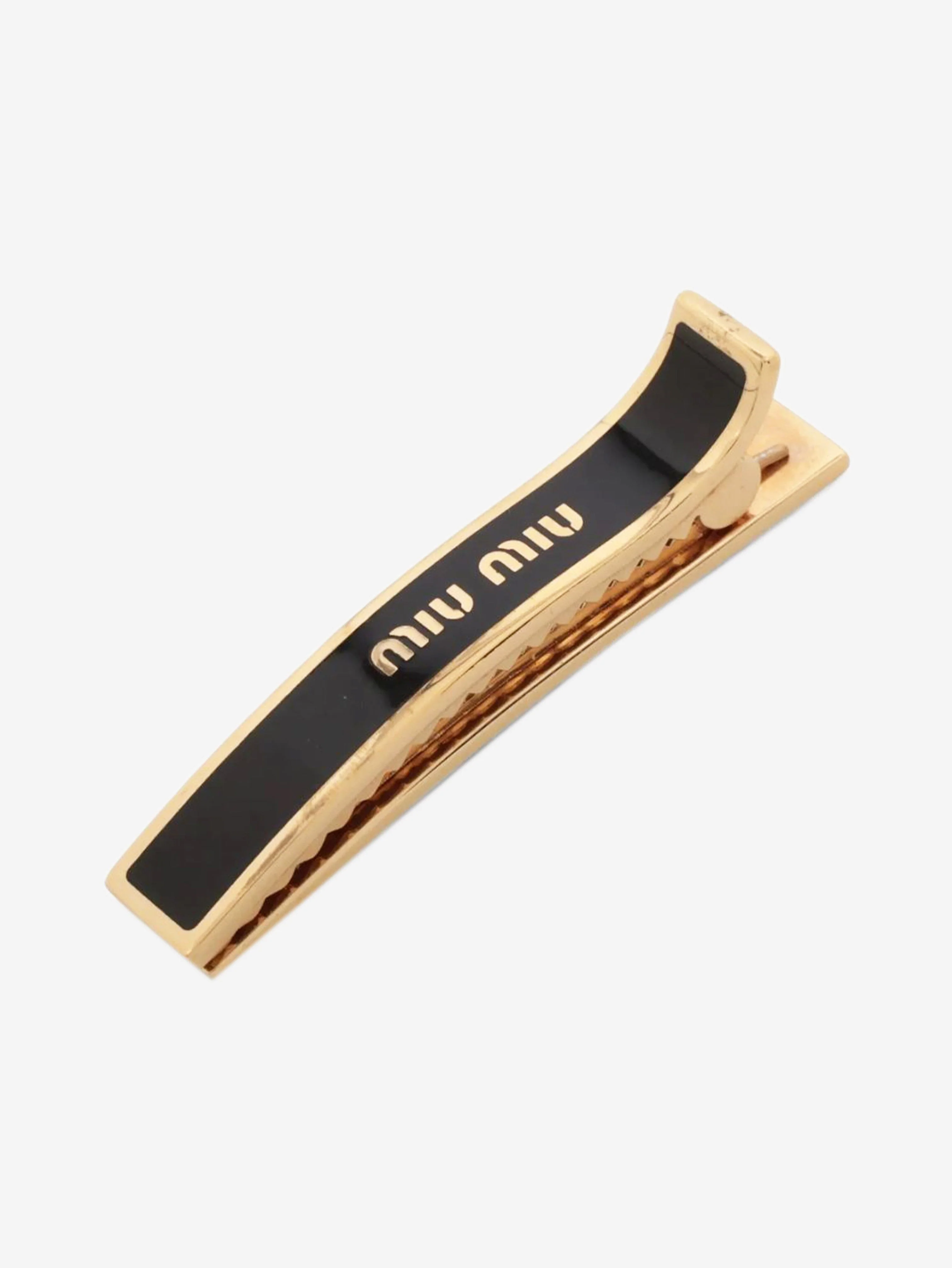 Gold and black logo hair clip